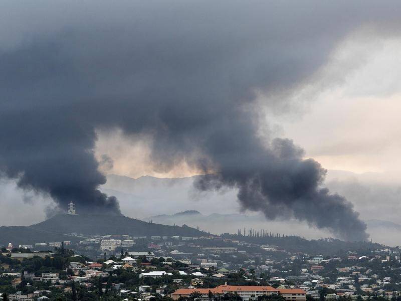 Australia will operate further repatriation flights out of New Caledonia following violent unrest. (AP PHOTO)